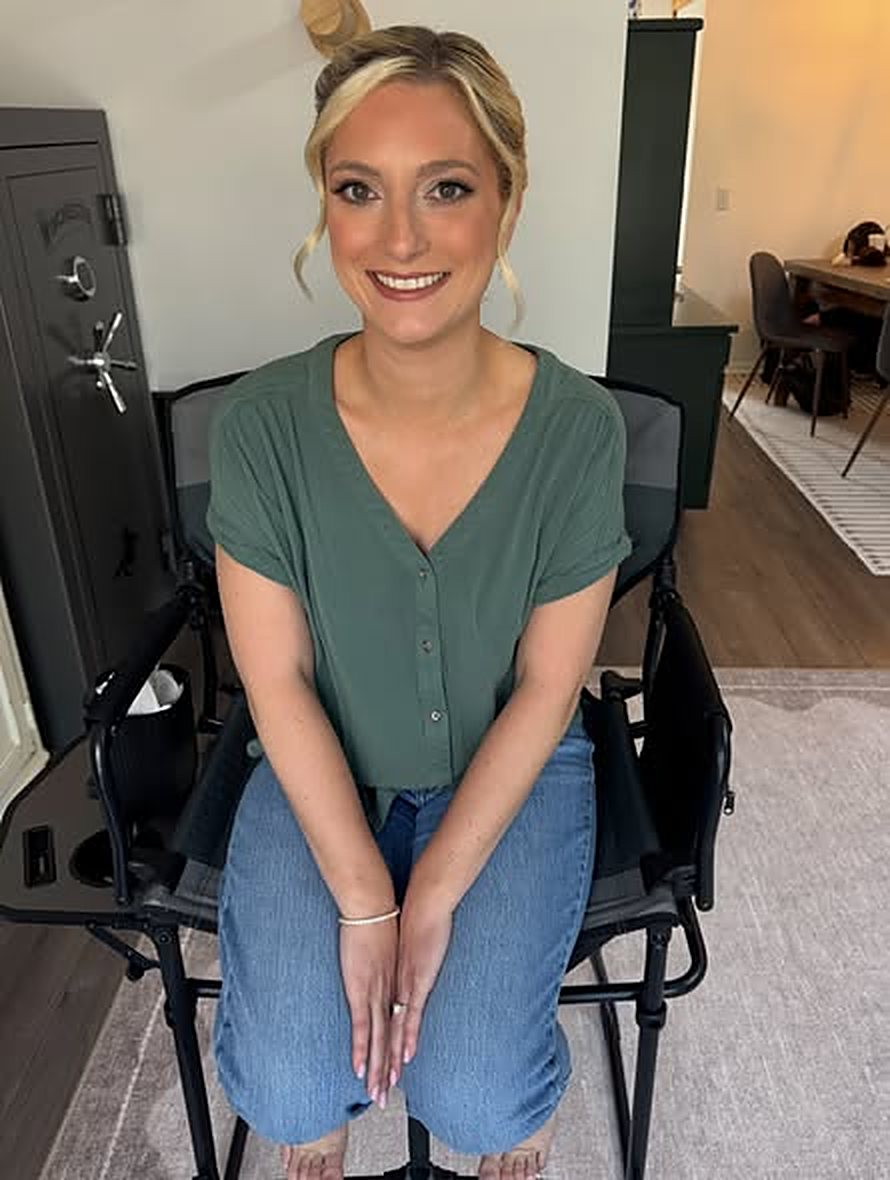 Client with fresh, glowy makeup in a makeup chair
