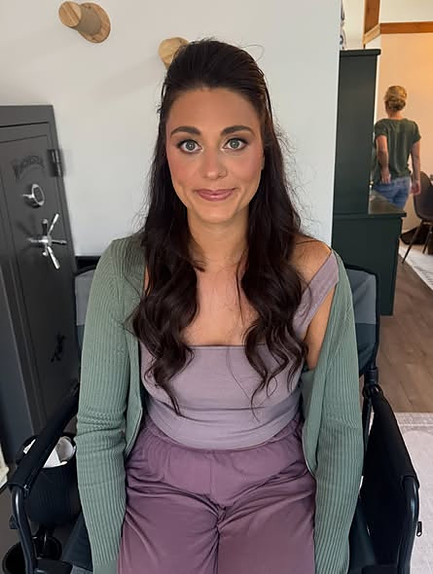 Client with soft glam makeup and long waves
